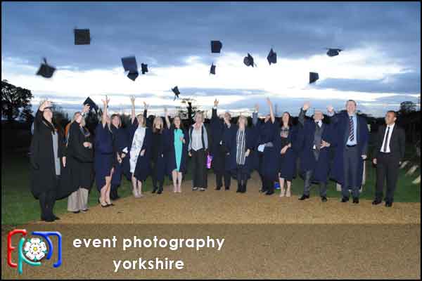 graduation caps in the air